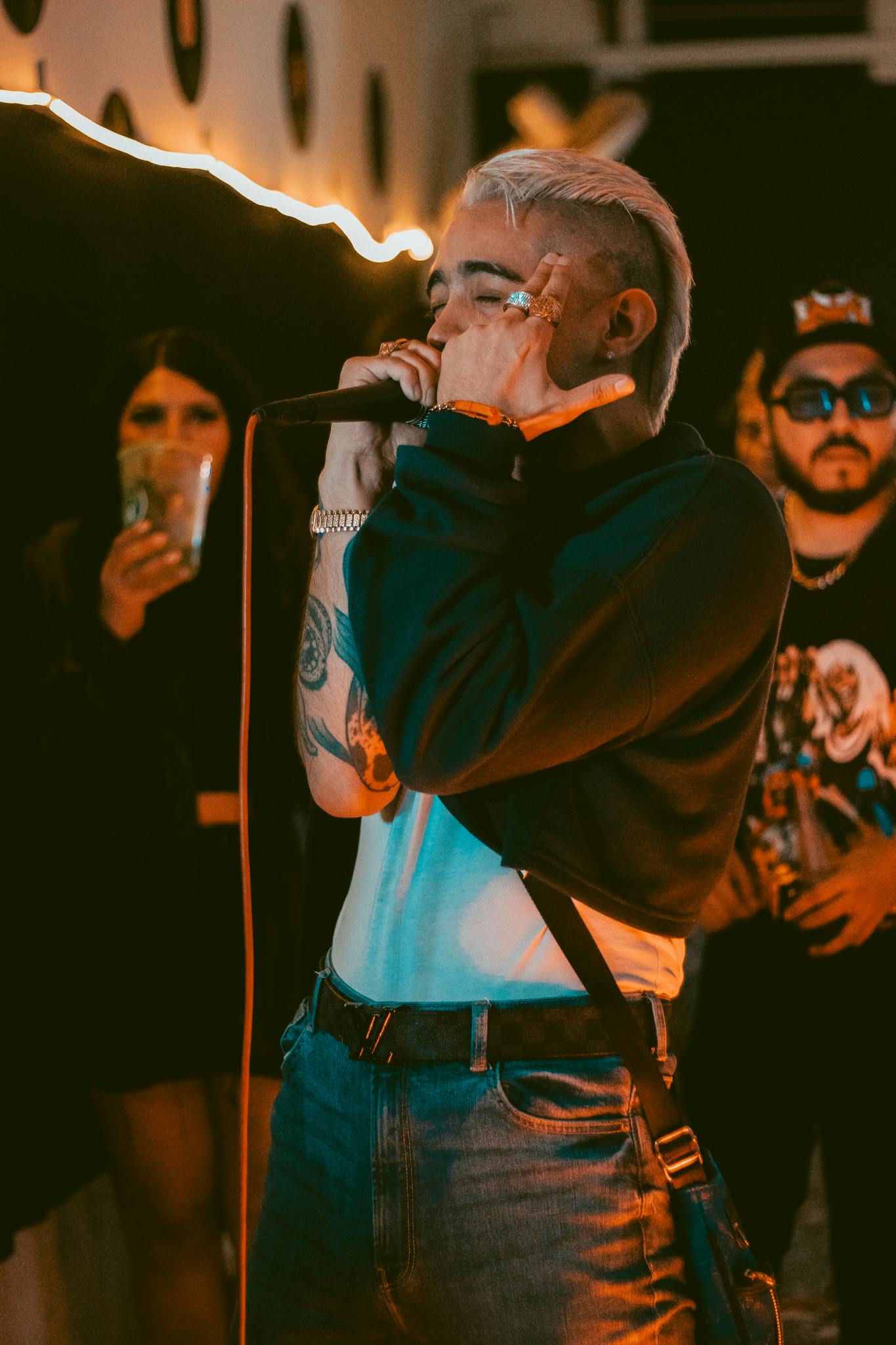 A captivating singer performing with passion in a lively nightclub setting.